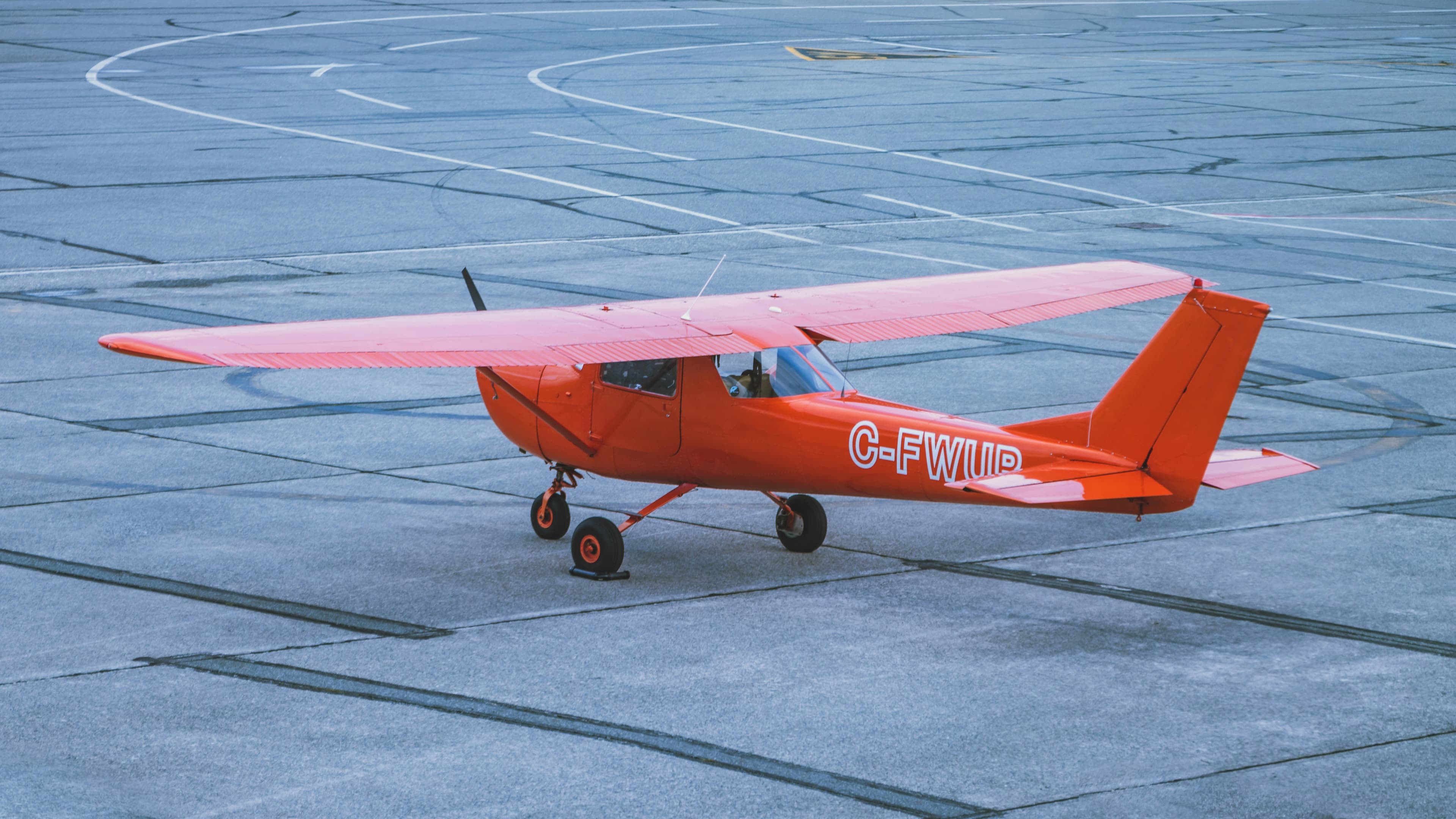 Single-engine trainer aircraft on the ramp at a flight school